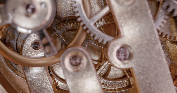 Extreme close-up of clock machine part.