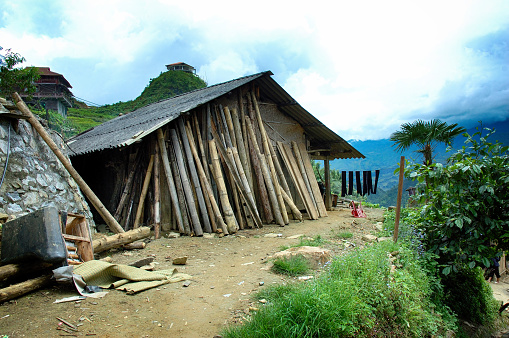 House of H'mong ethnic minority people with lots of reserve firewood in Sapa, Vietnam