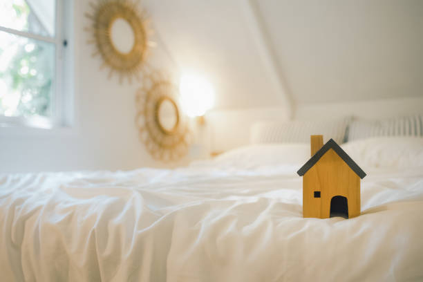 istock wood home model on bed in bedroom 1413961921