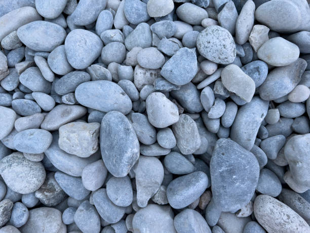 istock Round grey stones on the beach, pebbles pattern and texture, zen meditation, natural background. 1413961927