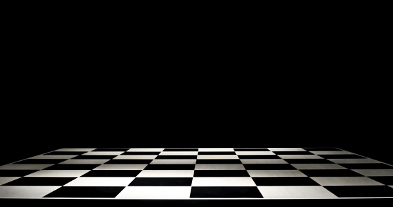 Close-up of empty chessboard against black background.