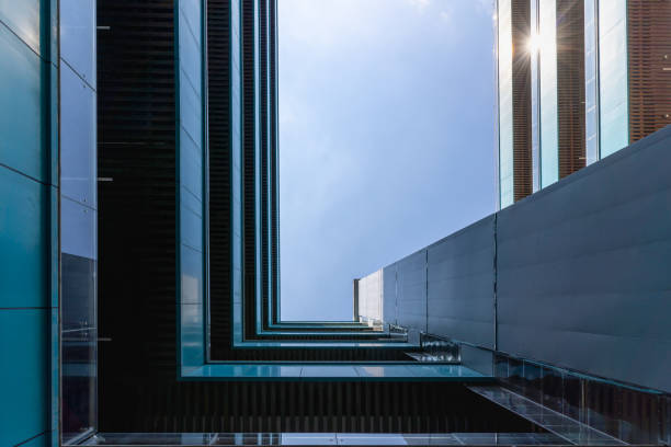 istock Looking up at the square structure of urban buildings 1413965727