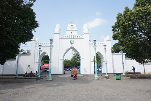 Surakarta, ID - July 16th, 2022. The situation in front of the Great Mosque of Surakarta. peoples walking into the mosque for praying. One of historical building at Solo City.