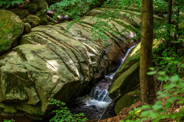 istock Waterfall on Bily Stolpich creek in national reserve Jizera mountain beechwoods. 1413968717