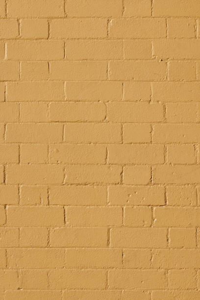 istock Part of a painted old beige brick wall 1413971143