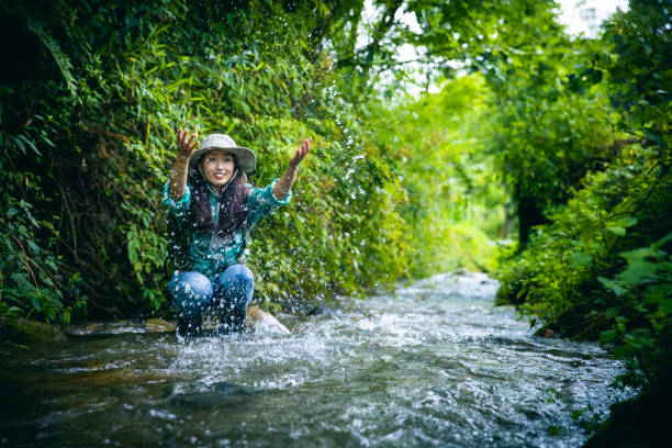 Women palying water in a mountain stream