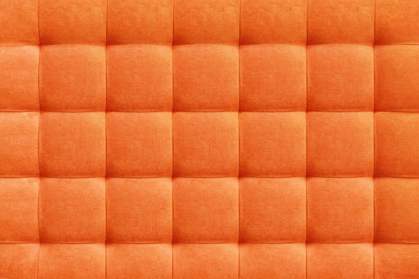 Orange suede leather background, classic checkered pattern for furniture, wall, headboard