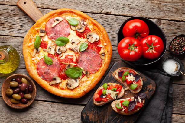 istock Italian cuisine. Pizza and toasts 1413975841