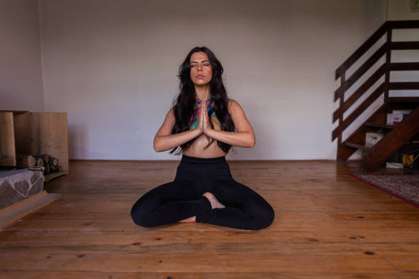 istock Yoga and meditation female instructor 1413977341