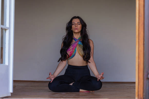 istock Young female yogi meditating 1413978035