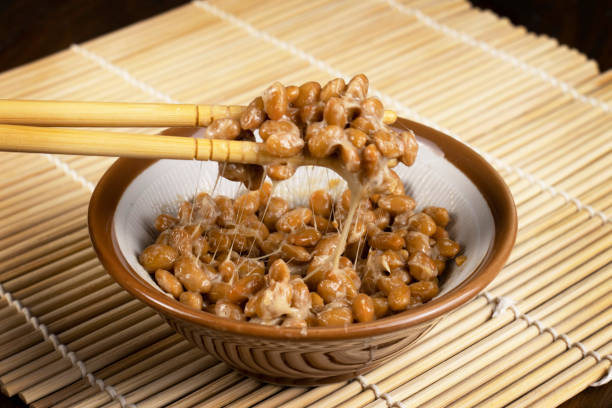 natto is a traditional japanese food made of fermented soybean, served as a breakfast food with rice - natto stockfoto's en -beelden