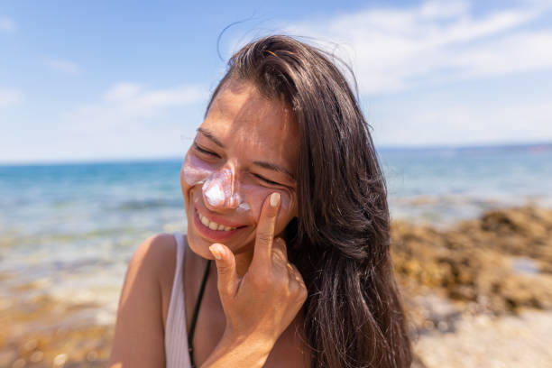 istock Protecting my face skin from sun UV 1413981576