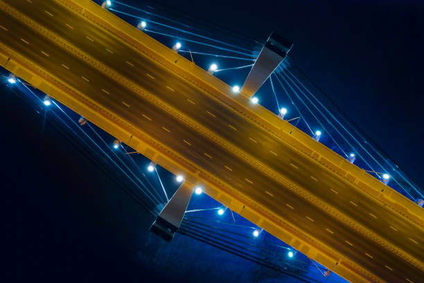 highway suspension bridge at night (aerial) - wroclaw traffic night flowing imagens e fotografias de stock