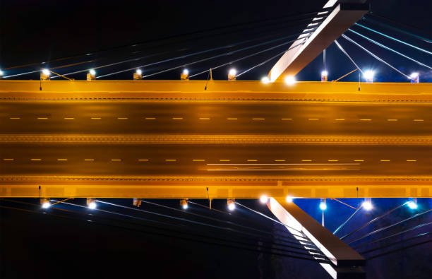 highway suspension bridge at night (aerial) - wroclaw traffic night flowing imagens e fotografias de stock