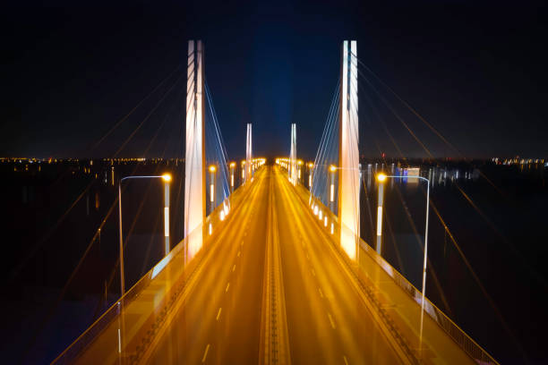 highway suspension bridge at night (aerial) - wroclaw traffic night flowing imagens e fotografias de stock