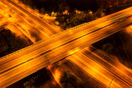 aerial view of highway road interchange with busy traffic