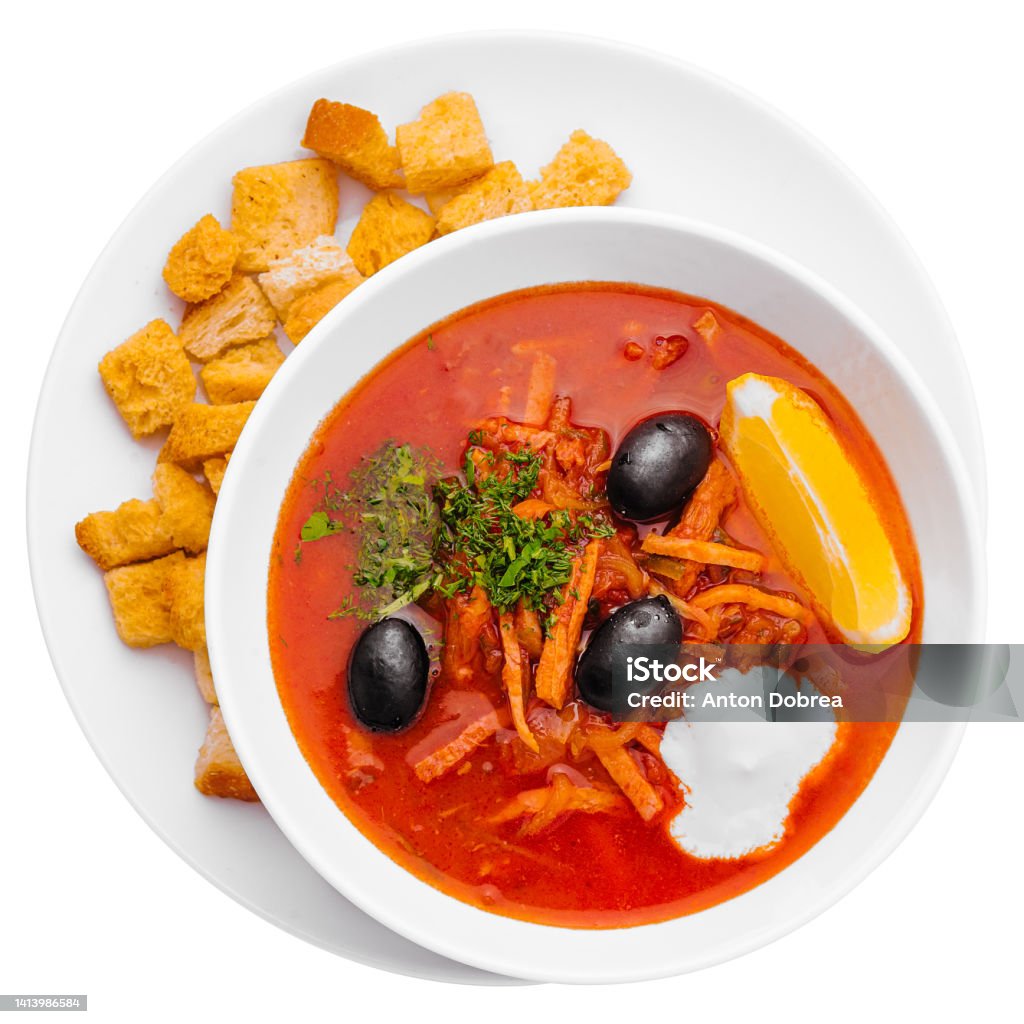hodgepodge soup in ceramic pot on white Above Stock Photo