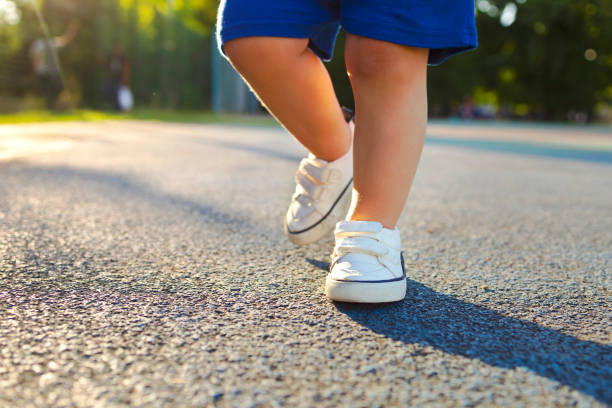 istock toddlers feet outdoors, children's activity 1413987933