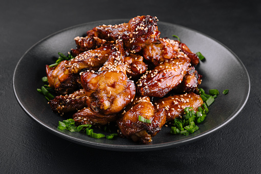 Delicious chicken wings with special marinade and sesame