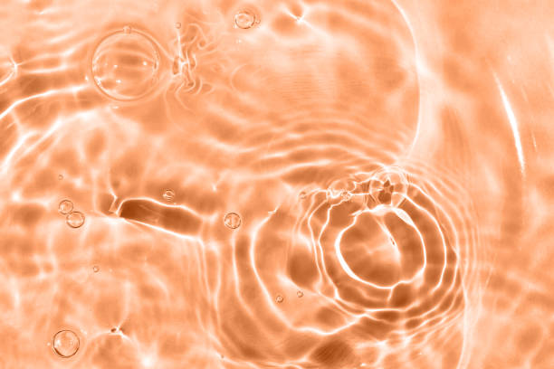 istock Sun glare, bubbles on the water, brown 1413991799
