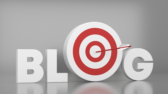 Red Dartboard And 3D Blog Text on Gray background. Success And Goal concept.