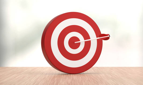 istock Red Dartboard and arrow on the wood backdrop. 1413992246