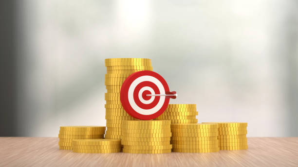 istock Red Dartboard on the golden coins. 1413992280
