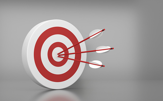 Red Dartboard and arrow on the Gray background. Success and Goal Concept.