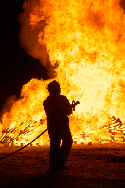 istock Firefighters putting out a fire. Destruction and disaster 1413993938