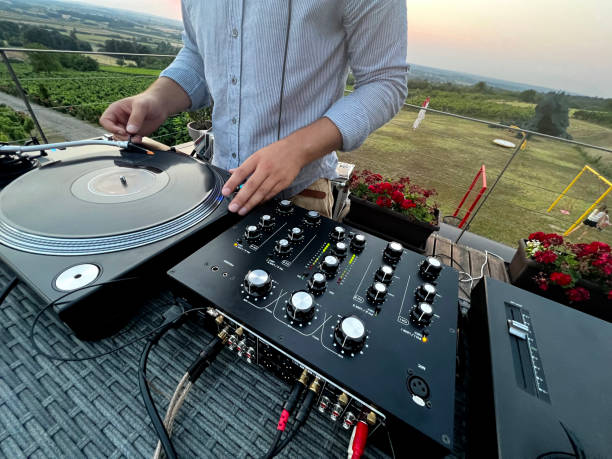 istock Dj mixing music outdoors 1413996029