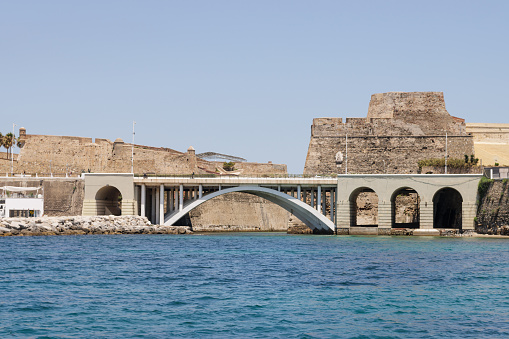 View from a tourist boat of the Royal Walls of Ceuta and its navigable moat, horizontal