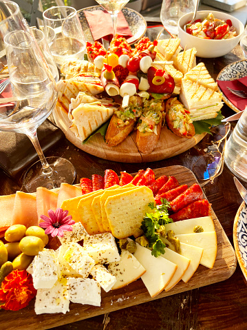 Italian appetizers or antipasto set with gourmet food on kitchen table top view