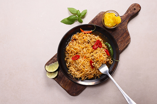 Noodles with Chillies and spicy sauce with fork