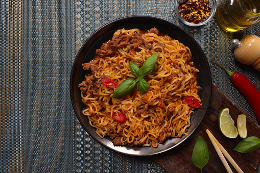 Noodles with Chillies and spicy sauce with chopsticks