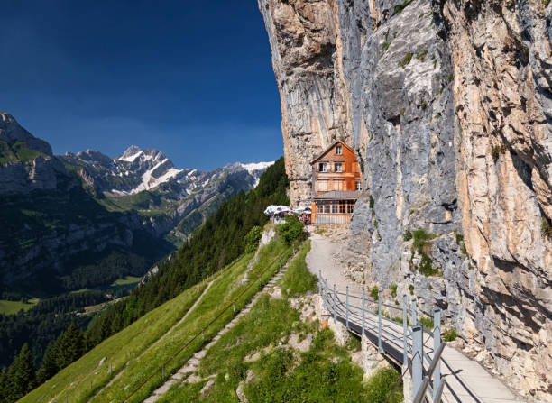 Chalet in the rock on Ebenalp, Canton of Appenzell, Switzerland Chalet on Ebenalp, Switzerland appenzell stock pictures, royalty-free photos & images