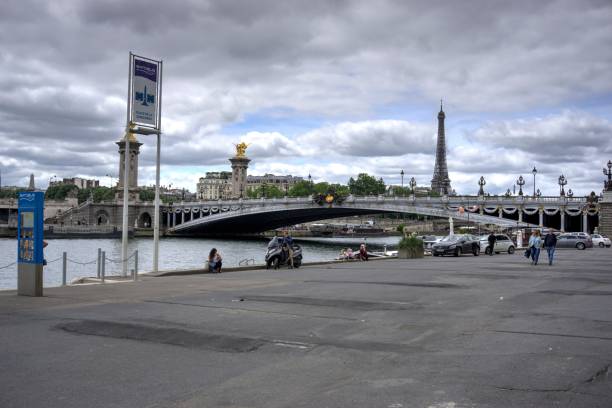 Batobus Paris France Paris, France - May 26, 2022: Batobus stop Place de la Concorde with motion blurred pedestrians and Pont Alexandre III bridge and Eiffel Tower in background supersonic airplane editorial airplane air vehicle stock pictures, royalty-free photos & images