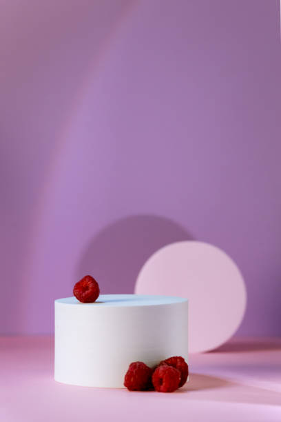 istock Geometric Podium for Product Demonstration and Raspberry on Pink Background with Shadow Stands for Presentation of Cosmetics Vertical 1414002200