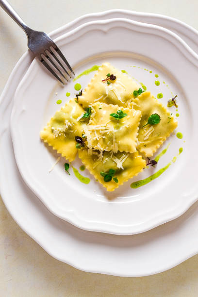 istock Ravioli with spinach and cheese, green sauce, on a light background, selective focus, no people, 1414004163