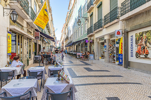 May, 2022. Lisbon, Portugal. A restaurant on a pedestrian shopping street in the centre of the city.