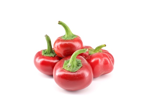 Round red hot chili peppers on white background. Cherry peppers