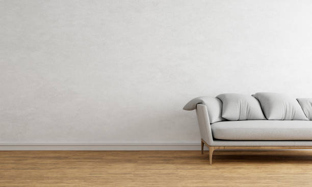 istock White empty wall with gray sofa made from wood and fabric textile. Interior and architecture background concept. 3D illustration rendering 1414010115