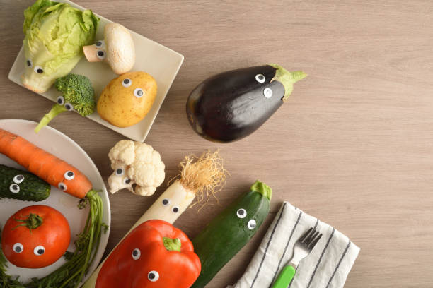 istock Child nutrition concept with vegetables on wooden table top view 1414010156