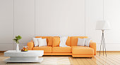 istock Cozy orange sofa in modern white wooden wall in empty room with plants orange juice carpet and floor lamp on wooden planks parquet floor. Architecture and interior concept. 3D illustration rendering 1414010413