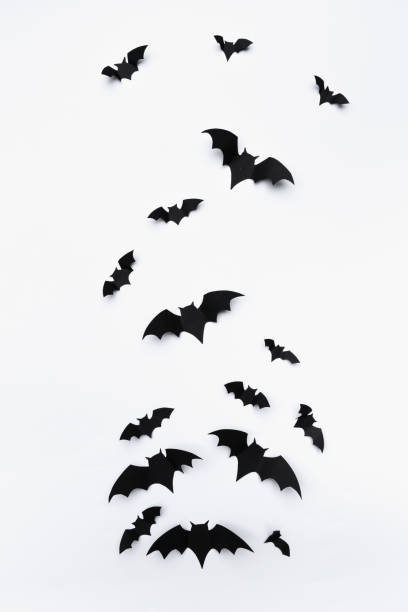 istock halloween and decoration concept - paper bats flying 1414010746