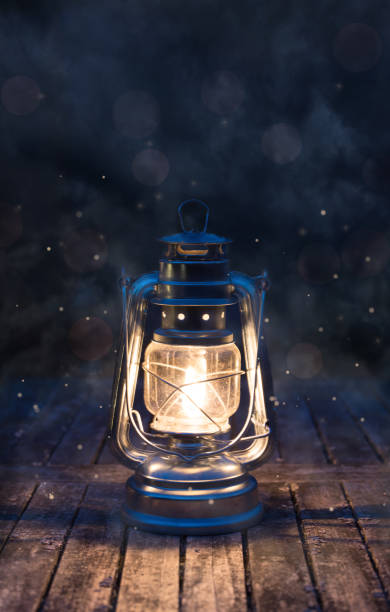 istock Oil lamp glowing at night - dark background 1414010769