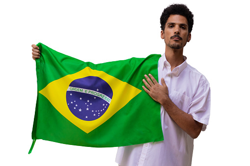 Black man holds Brazilian flag isolated.