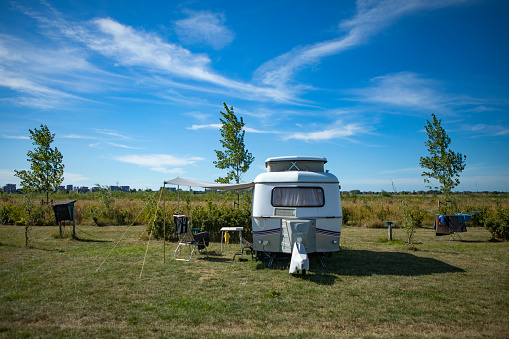 Row of static mobile homes on caravan site in rural Wales, places where people come to relax and vacation away from the stresses of the world.