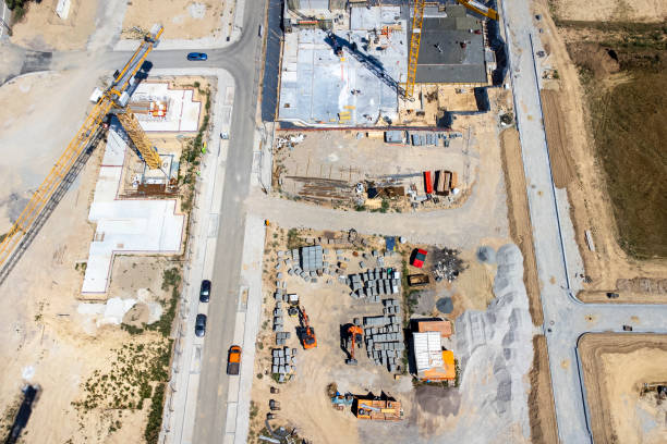 istock Large construction site, cranes and equipment - aerial view 1414014213