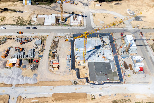 istock Large construction site, cranes and equipment - aerial view 1414014248