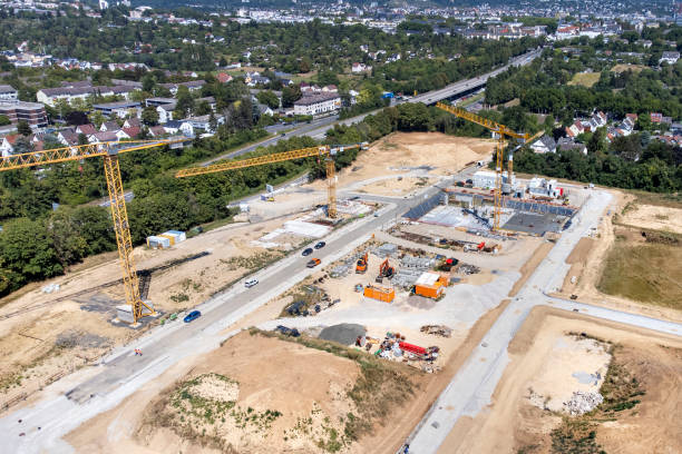 istock Large construction site, cranes and equipment - aerial view 1414014273